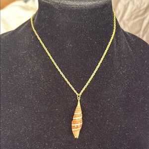 Gold tone chain with real shell pendant embellished with 24kt gold plate